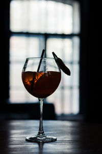 Close-up of wineglass on table