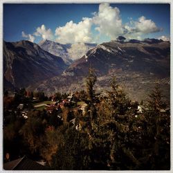 Scenic view of mountains against cloudy sky