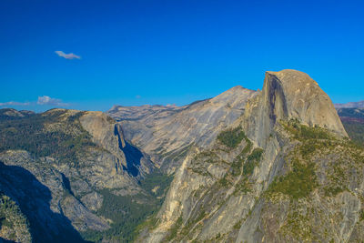 View of mountain range against blue sky