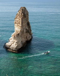 High angle view of rock formation in sea