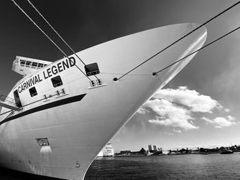 Ship sailing in sea against sky