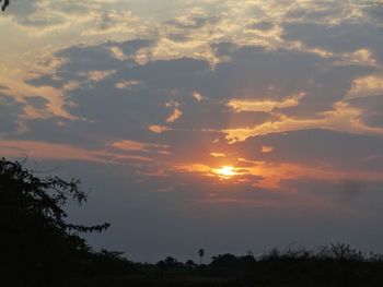 Scenic view of silhouette landscape against sky at sunset