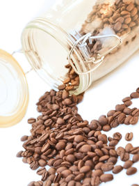 Close-up of coffee beans against white background