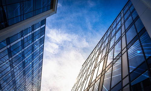 Low angle view of modern buildings against sky