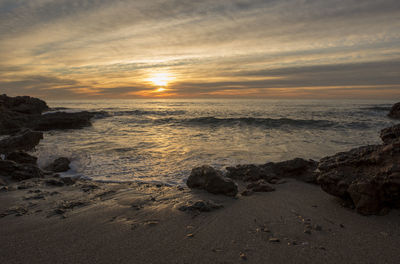 Scenic view of sea against sky during sunset