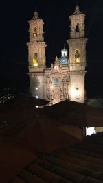 View of church lit up at night