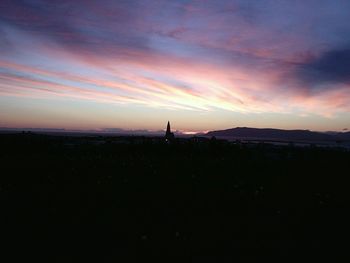 Silhouette of people at sunset