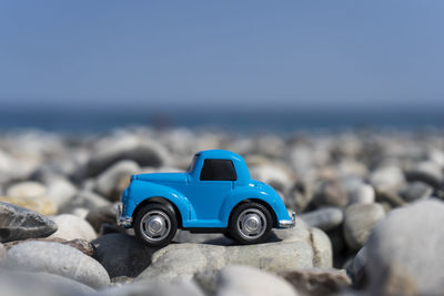 A car standing on the stones on the beach