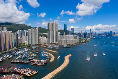 Aerial view of city buildings at waterfront