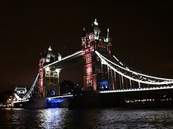 Illuminated tower bridge at night