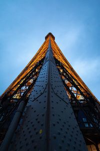 Low angle view of building against cloudy sky