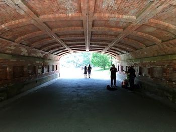 People walking in tunnel