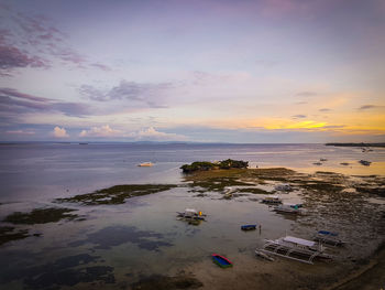 High angle view of sea against sky during sunset