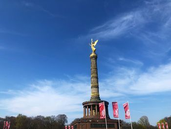Low angle view of statue of liberty against sky