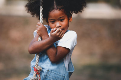 Portrait of girl standing outdoors