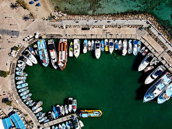 High angle view of people by boats in canal