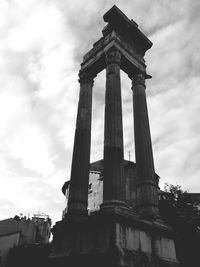 Low angle view of monument against cloudy sky