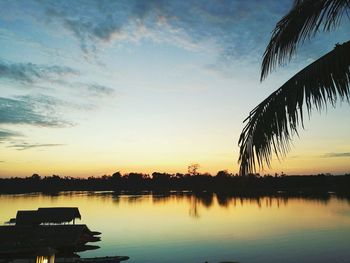 Scenic view of lake against sky during sunset