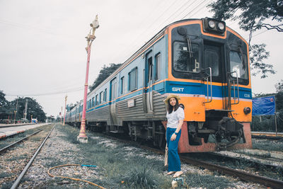 Train at railroad station against sky