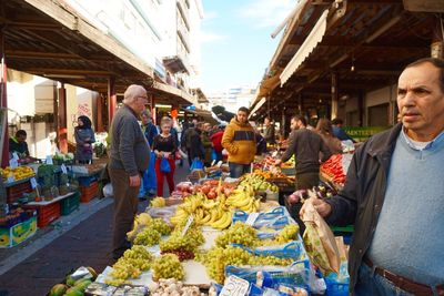 People at market stall
