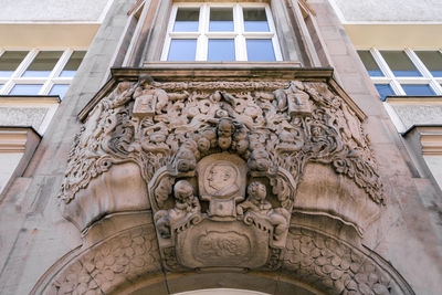 Low angle view of statue against building