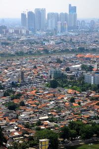 Aerial view of cityscape against sky