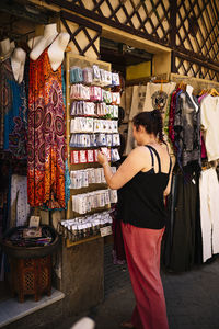Woman buying souvenirs at the street market