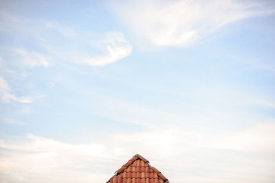 Low angle view of roof against sky