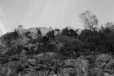 Low angle view of rock formation against sky