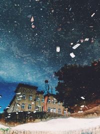 Reflection of building in puddle