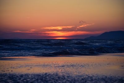 Scenic view of sea at sunset