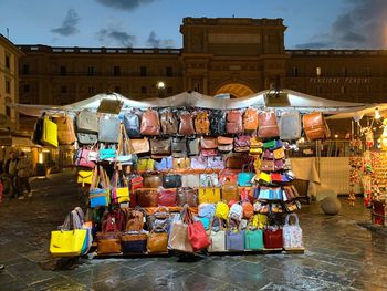 Group of people at market stall in city