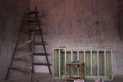 Empty chairs and table in abandoned room