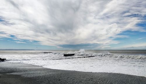 Scenic view of beach against sky