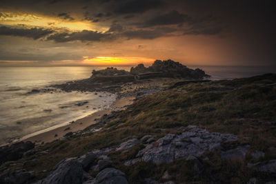 Scenic view of sea against sky during sunset