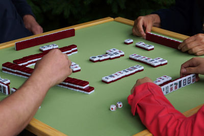 High angle view of hands playing piano