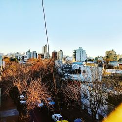 Cityscape against clear sky during winter