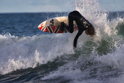 Man surfing in sea