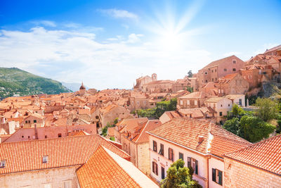 High angle view of buildings in town against sky