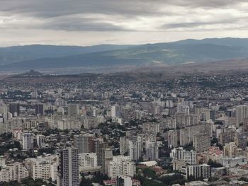 High angle view of buildings in city against sky