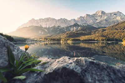 Scenic view of lake and mountains against sky