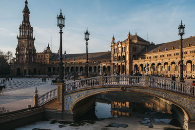 Arch bridge over river in city