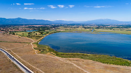 Scenic view of landscape and lake against sky