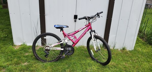 Bicycle leaning on field