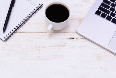 High angle view of coffee cup on table