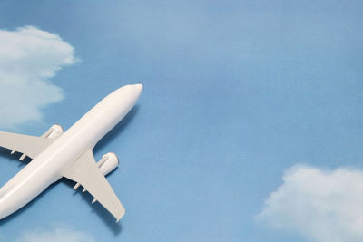 Close-up of model airplane on sky patterned table