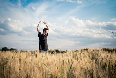 People standing on grassy field