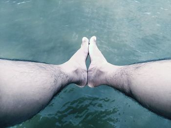 Low section of person in swimming pool