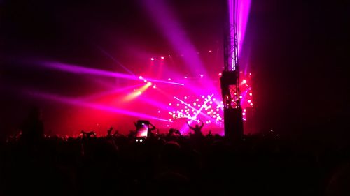 People enjoying music concert at night