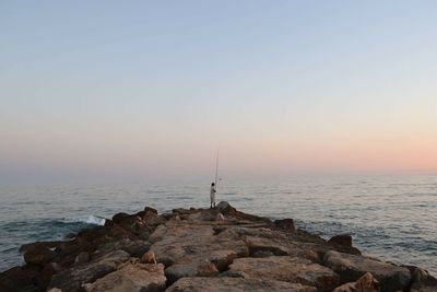 Scenic view of sea at sunset